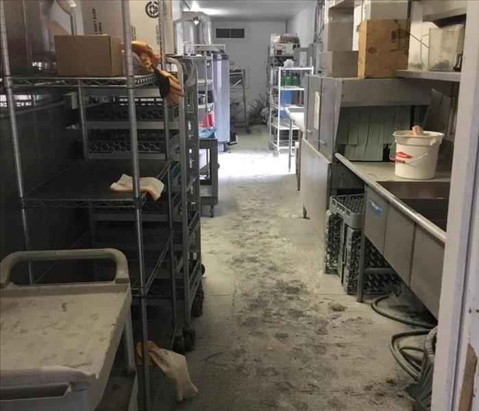 back room of building with shelves dirty