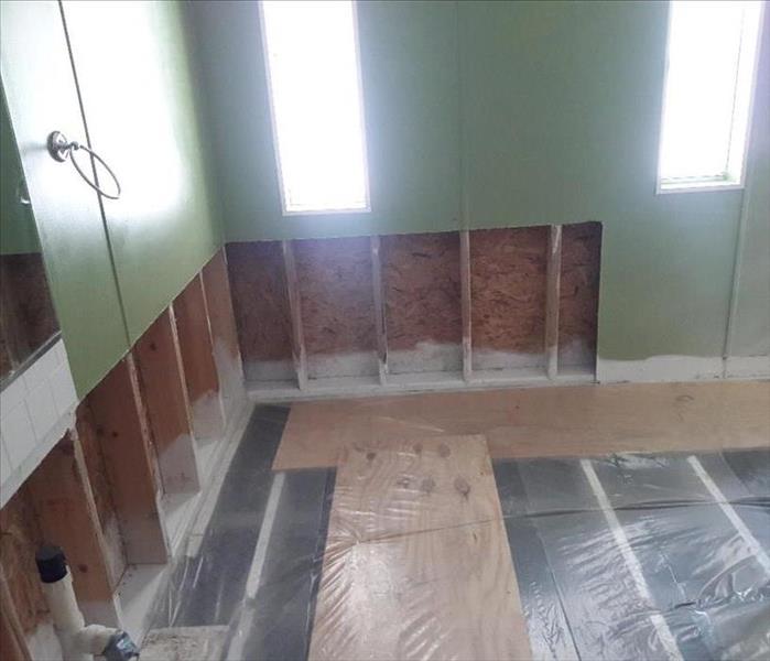empty bathroom missing drywall and flooring