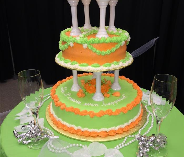 green and orange wedding cake on green table